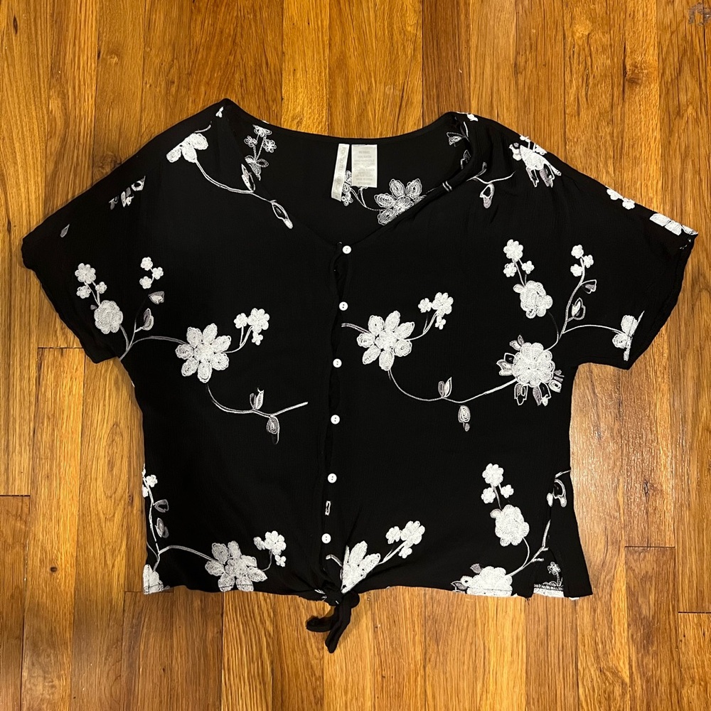 Black with white floral decor, button down, twist front